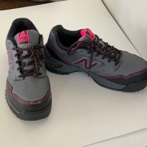 Pink, black and grey New Balance tennis shoes